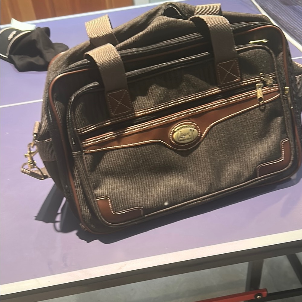 Brown Messenger Bag with Gold Accents and Structured Design